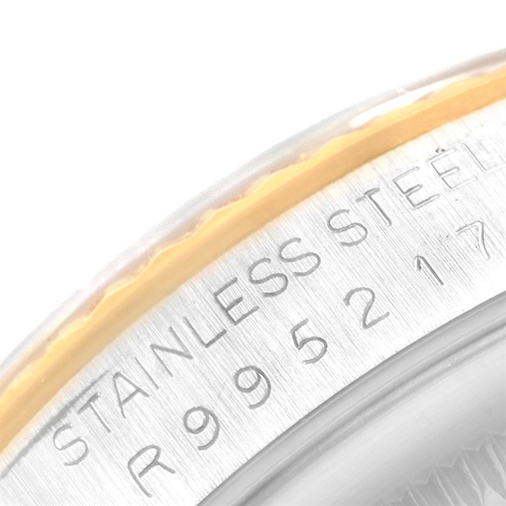 The image shows a close-up of the stainless steel case back with engraved text of a Rolex Datejust 16233 Men's Steel and Gold (two tone) White Dial 16233 Men's Steel and Gold (two tone) White Dial watch.