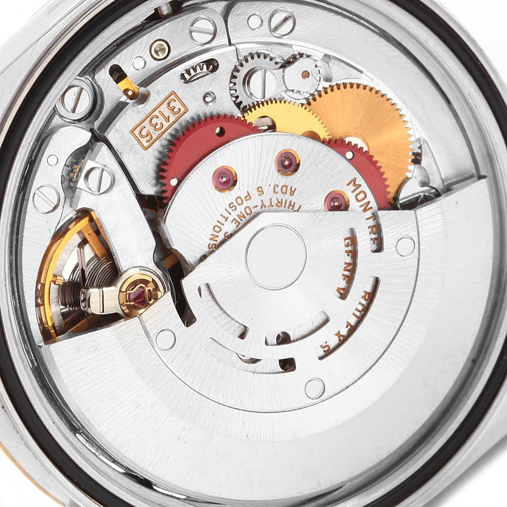 The image shows the internal mechanism of a Rolex Datejust 16233 Men's Steel and Gold (two tone) Champagne Dial 16233 Men's Steel and Gold (two tone) Champagne Dial watch at a close-up, detailed angle.