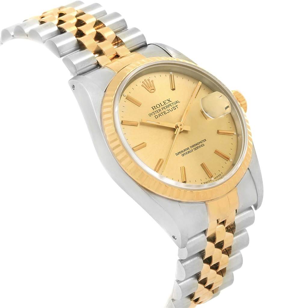 The image shows a side and angled view of the Rolex Datejust 16233 Men's Steel and Gold (two tone) Champagne Dial 16233 Men's Steel and Gold (two tone) Champagne Dial, highlighting its bezel, dial, and two-tone bracelet.