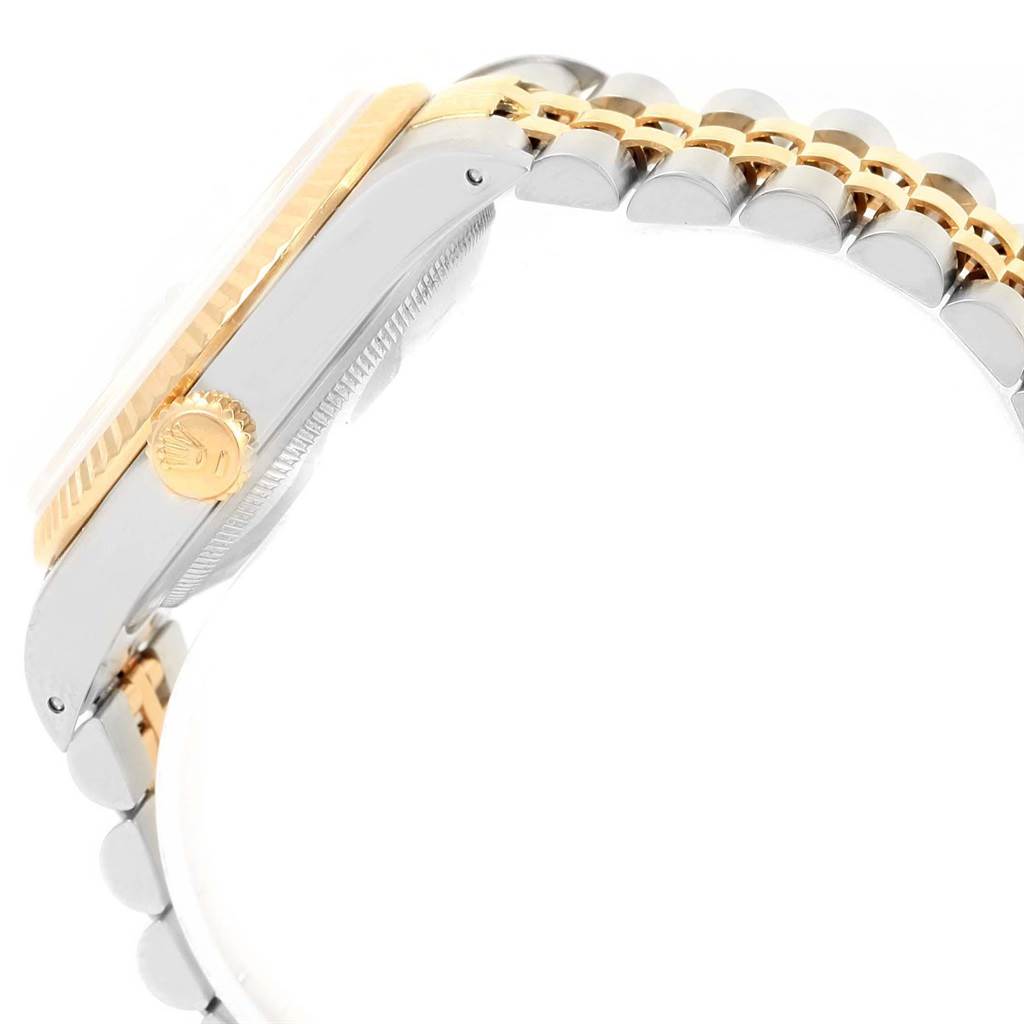 This image shows a side view of the Rolex Datejust 16233 Men's Steel and Gold (two tone) Champagne Dial 16233 Men's Steel and Gold (two tone) Champagne Dial watch, highlighting the crown, fluted bezel, and two-tone bracelet.