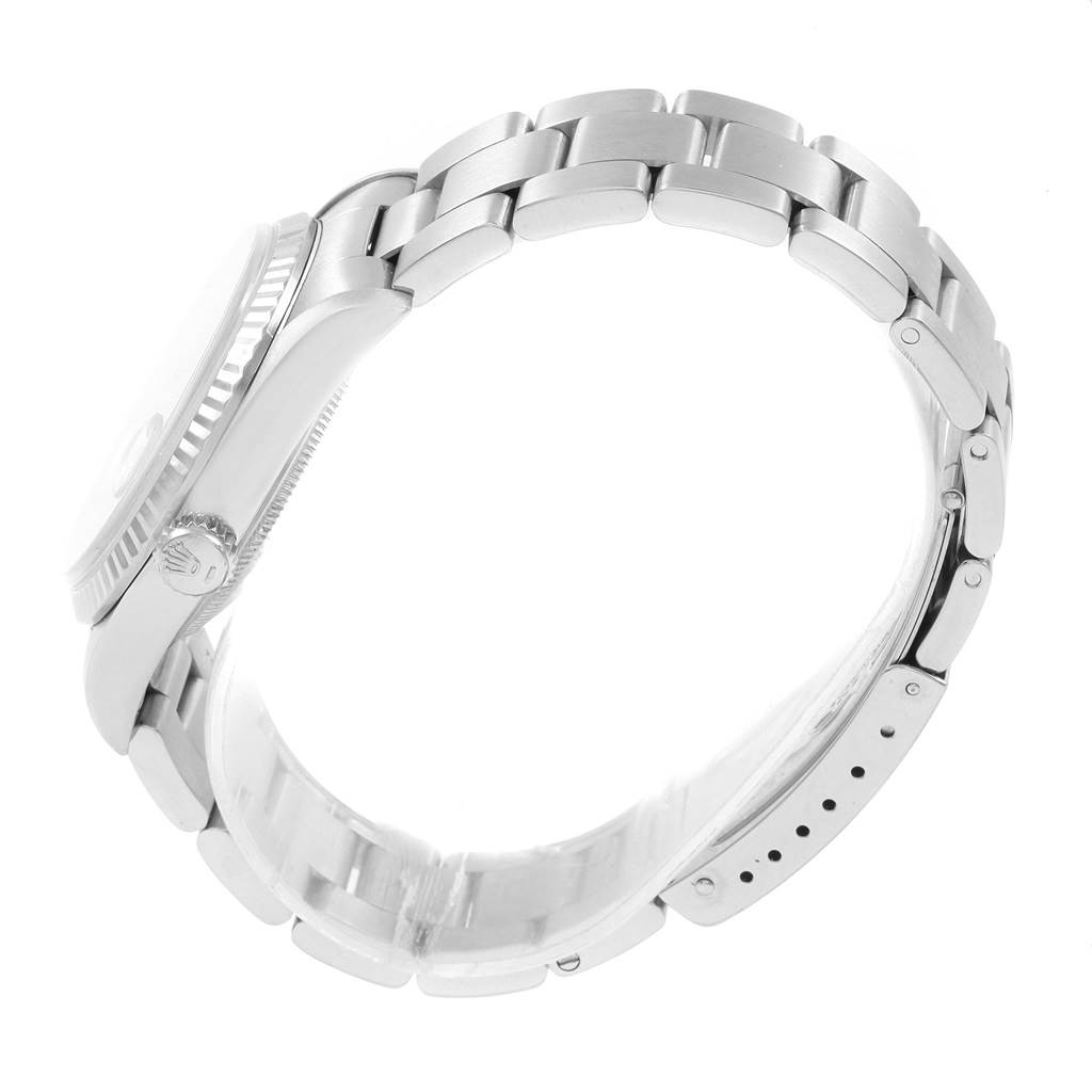 The image shows a side view of the Rolex Datejust 16234 Men
s Stainless Steel Silver Dial 16234 Men
s Stainless Steel Silver Dial watch, highlighting its bracelet, clasp, and crown.