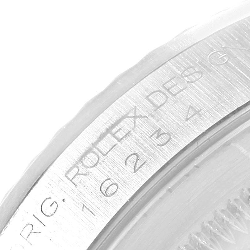 The image shows a close-up of the bezel and engraved markings of a Rolex Datejust 16234 Men
s Stainless Steel Silver Dial 16234 Men
s Stainless Steel Silver Dial watch.