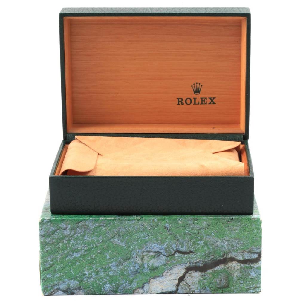 The image shows an open Rolex Datejust 16234 Men
s Stainless Steel Silver Dial 16234 Men
s Stainless Steel Silver Dial watch box with an interior compartment and leather-like cloth.