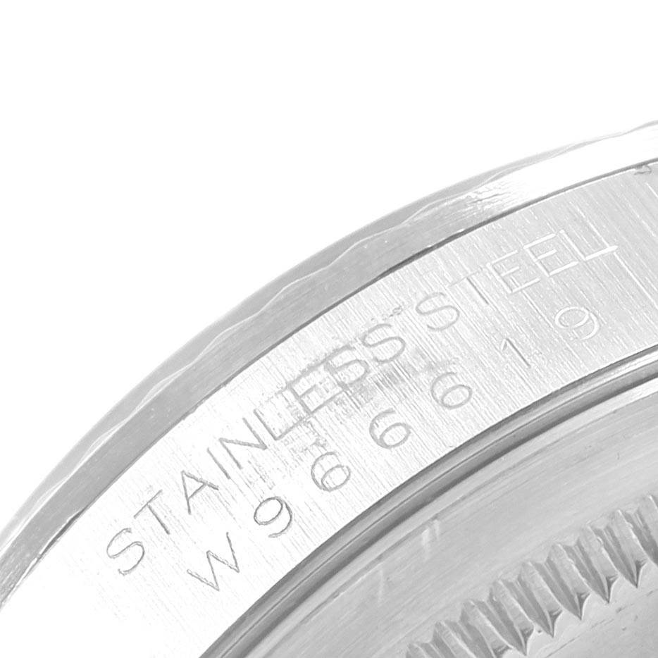 The image shows a close-up angle of the side of a Rolex Datejust 16234 Men
s Stainless Steel Silver Dial 16234 Men
s Stainless Steel Silver Dial watch, highlighting the stainless steel casing and engraved serial numbers.