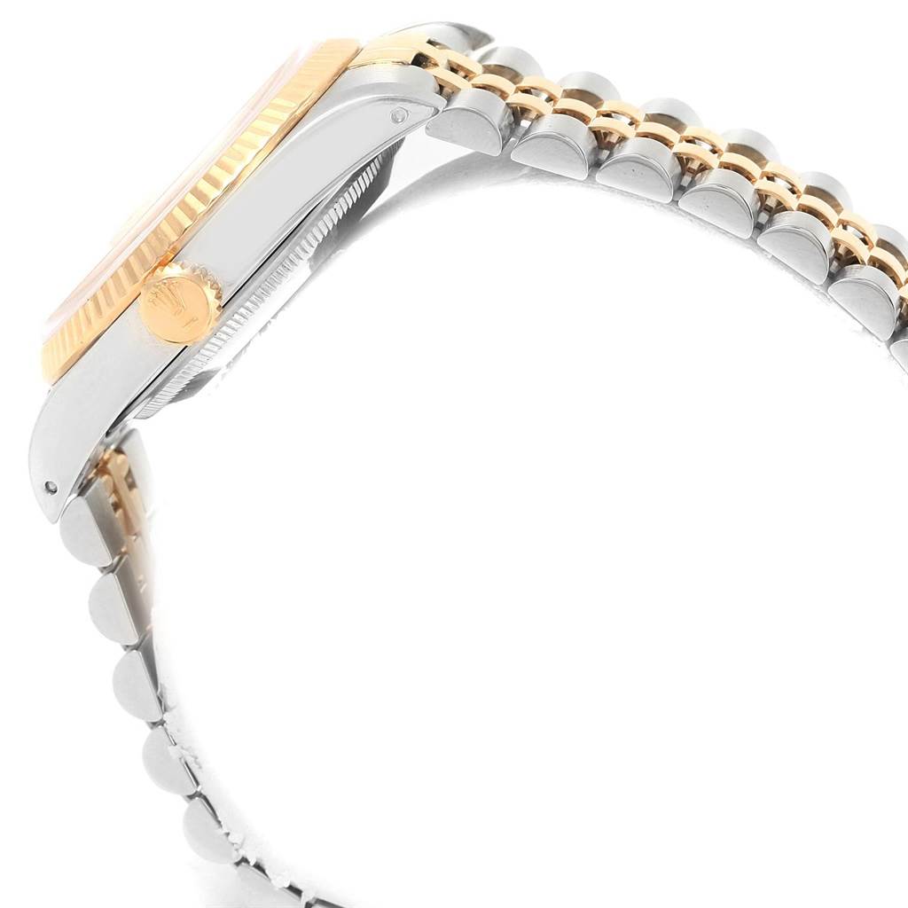 This side view of the Rolex Datejust 16233 Men's Steel and Gold (two tone) Champagne Dial 16233 Men's Steel and Gold (two tone) Champagne Dial shows the case, bezel, crown, and the bracelet.