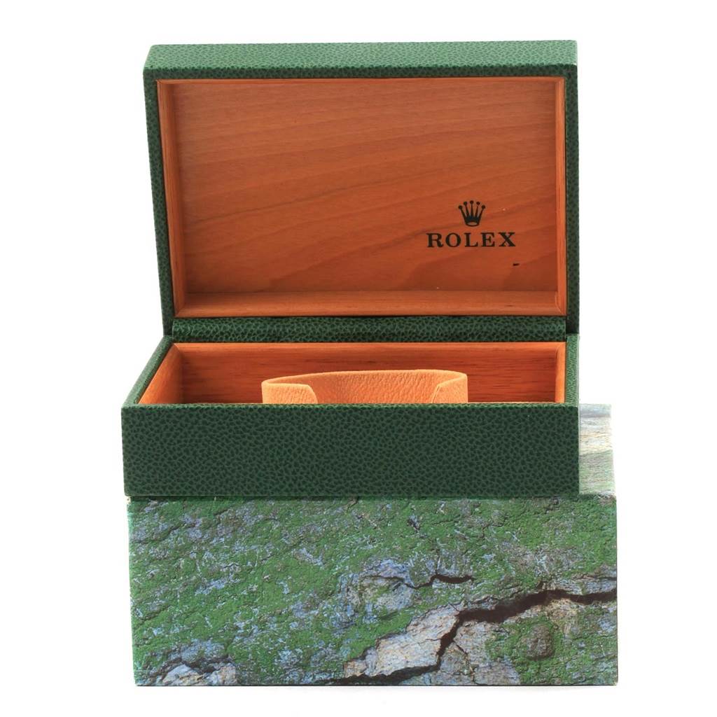 The image shows an open Rolex Datejust 16233 Men's Steel and Gold (two tone) Champagne Dial 16233 Men's Steel and Gold (two tone) Champagne Dial watch box with green exterior and wood interior.