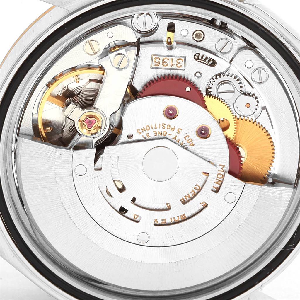 This image shows a close-up view of the Rolex Datejust 16233 Men's Steel and Gold (two tone) Champagne Dial 16233 Men's Steel and Gold (two tone) Champagne Dial's internal movement and mechanism.