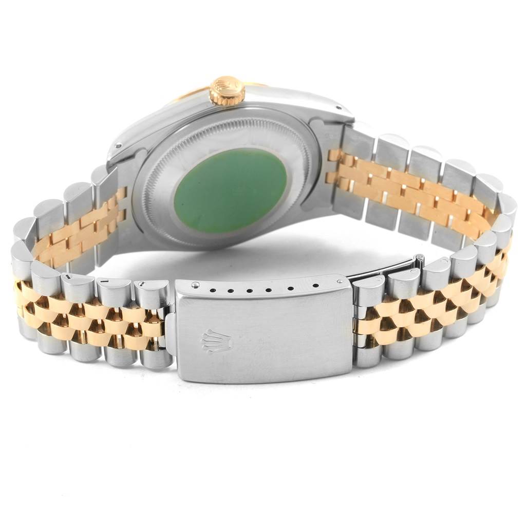 This image shows the back of a Rolex Datejust 16233 Men's Steel and Gold (two tone) Champagne Dial 16233 Men's Steel and Gold (two tone) Champagne Dial watch, highlighting the case back and two-tone bracelet with a closed clasp.