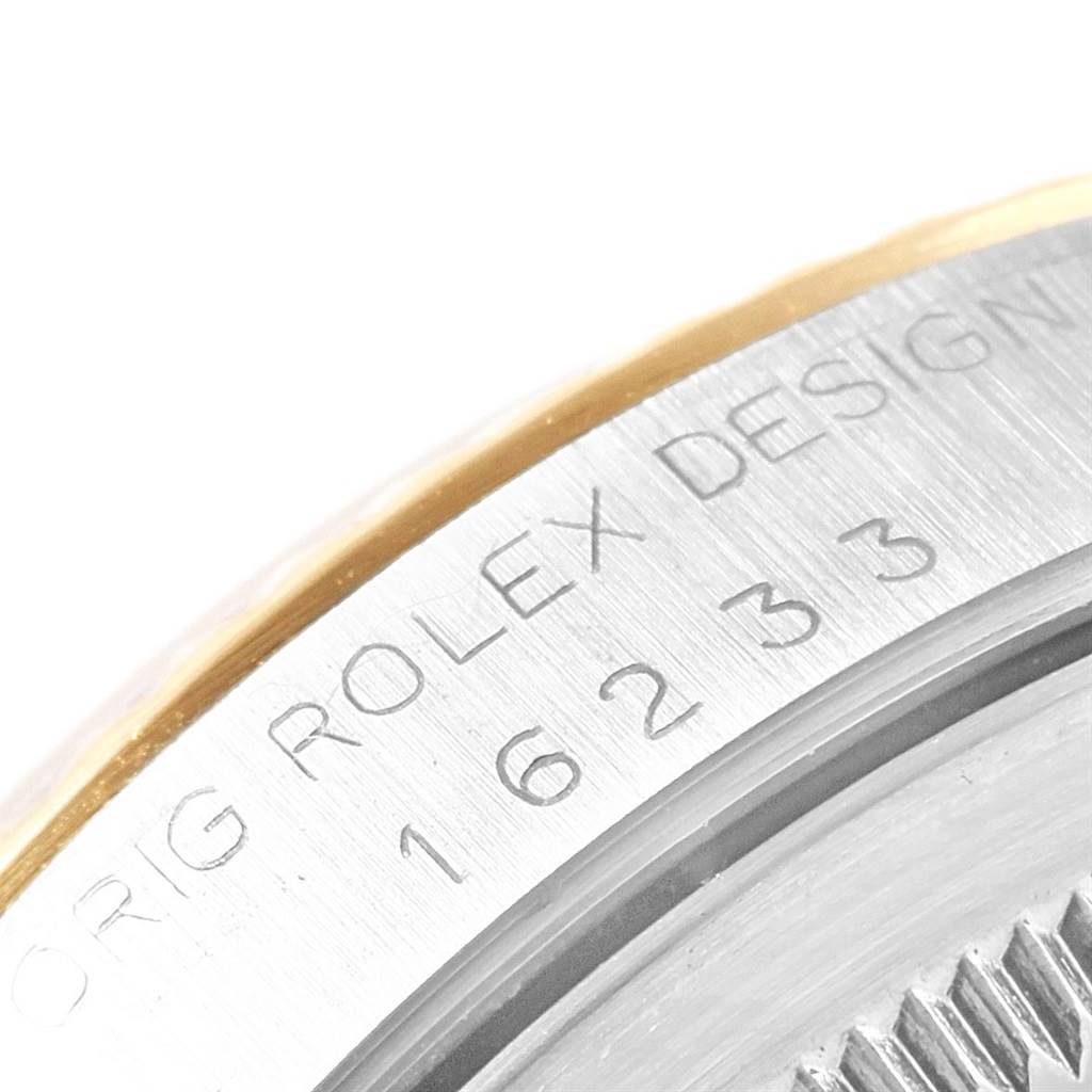 This close-up shows the engraved model number on the side of the Rolex Datejust 16233 Men's Steel and Gold (two tone) Champagne Dial 16233 Men's Steel and Gold (two tone) Champagne Dial watch case.