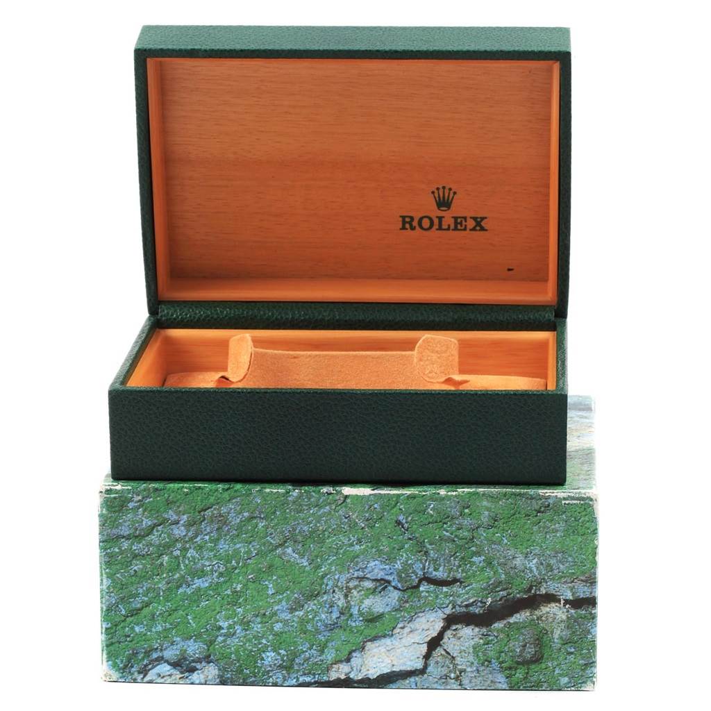 The image shows a green Rolex Datejust 16233 Men's Steel and Gold (two tone) White Dial 16233 Men's Steel and Gold (two tone) White Dial watch box with its lid open, revealing the interior and holder.