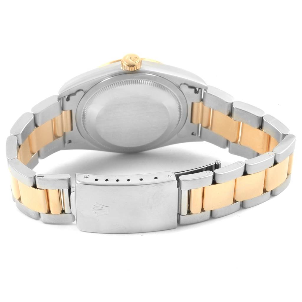 The image shows the back view of a Rolex Datejust 16233 Men's Steel and Gold (two tone) White Dial 16233 Men's Steel and Gold (two tone) White Dial, highlighting its case, clasp, and two-tone bracelet.