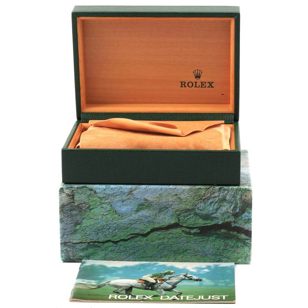 The image shows an open box for the Rolex Datejust 16233 Men's Steel and Gold (two tone) Champagne Dial 16233 Men's Steel and Gold (two tone) Champagne Dial watch, including the green outer box and a printed manual.