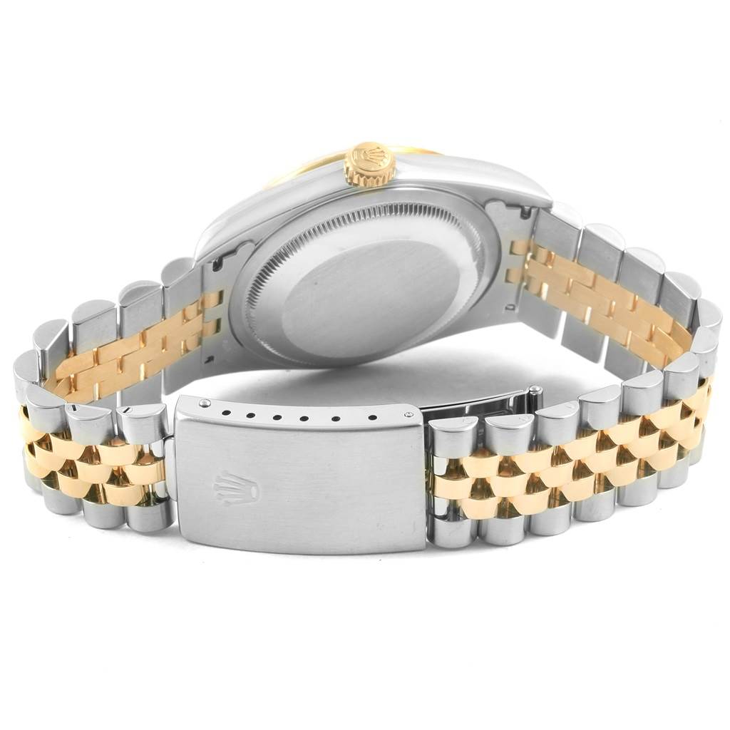 The image shows the back and side of a Rolex Datejust 16233 Men's Steel and Gold (two tone) Champagne Dial 16233 Men's Steel and Gold (two tone) Champagne Dial watch, highlighting the case, crown, and two-tone metal bracelet with the clasp.