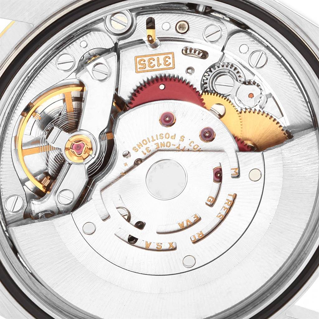 The image shows a close-up, detailed view of the movement and internal components of a Rolex Datejust 16233 Men's Steel and Gold (two tone) Champagne Dial 16233 Men's Steel and Gold (two tone) Champagne Dial watch.
