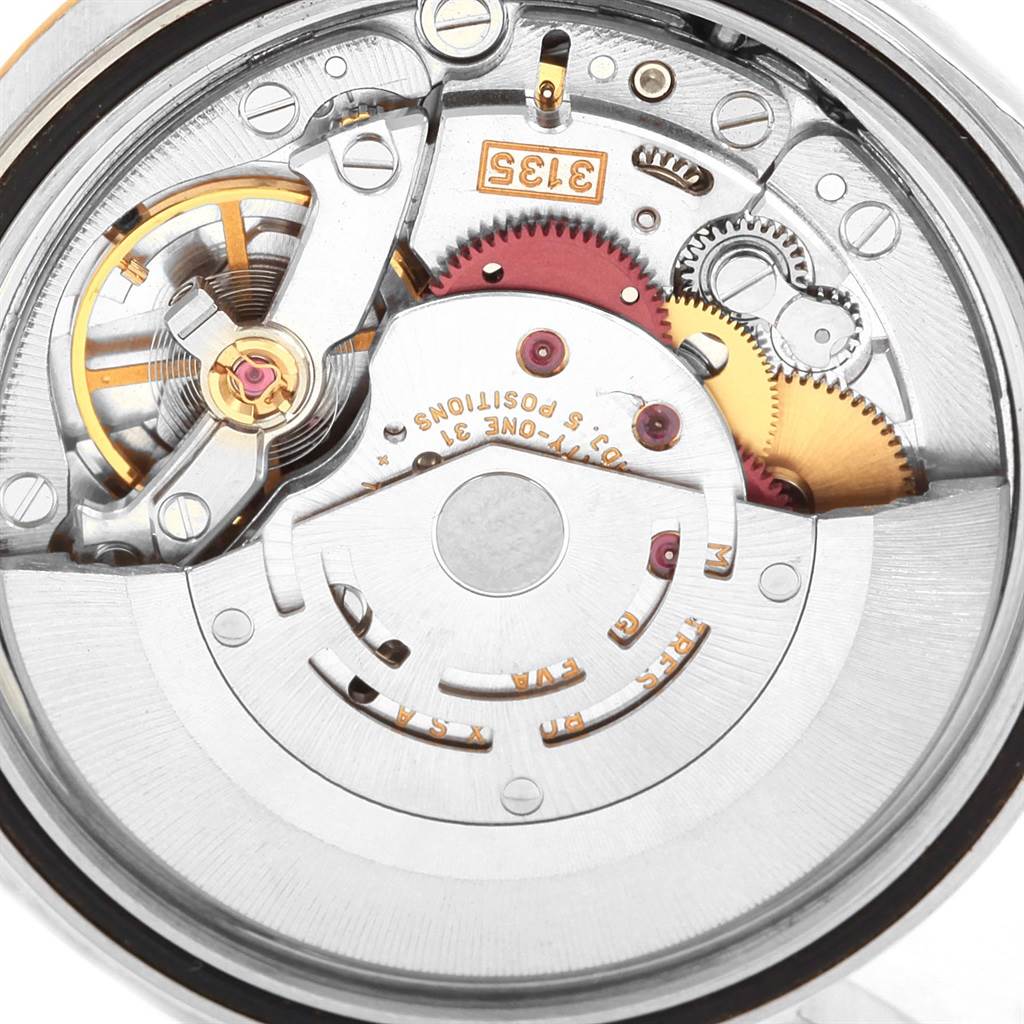 This image shows a close-up of the movement mechanism of a Rolex Datejust 16233 Men's Steel and Gold (two tone) Beige Dial 16233 Men's Steel and Gold (two tone) Beige Dial watch.