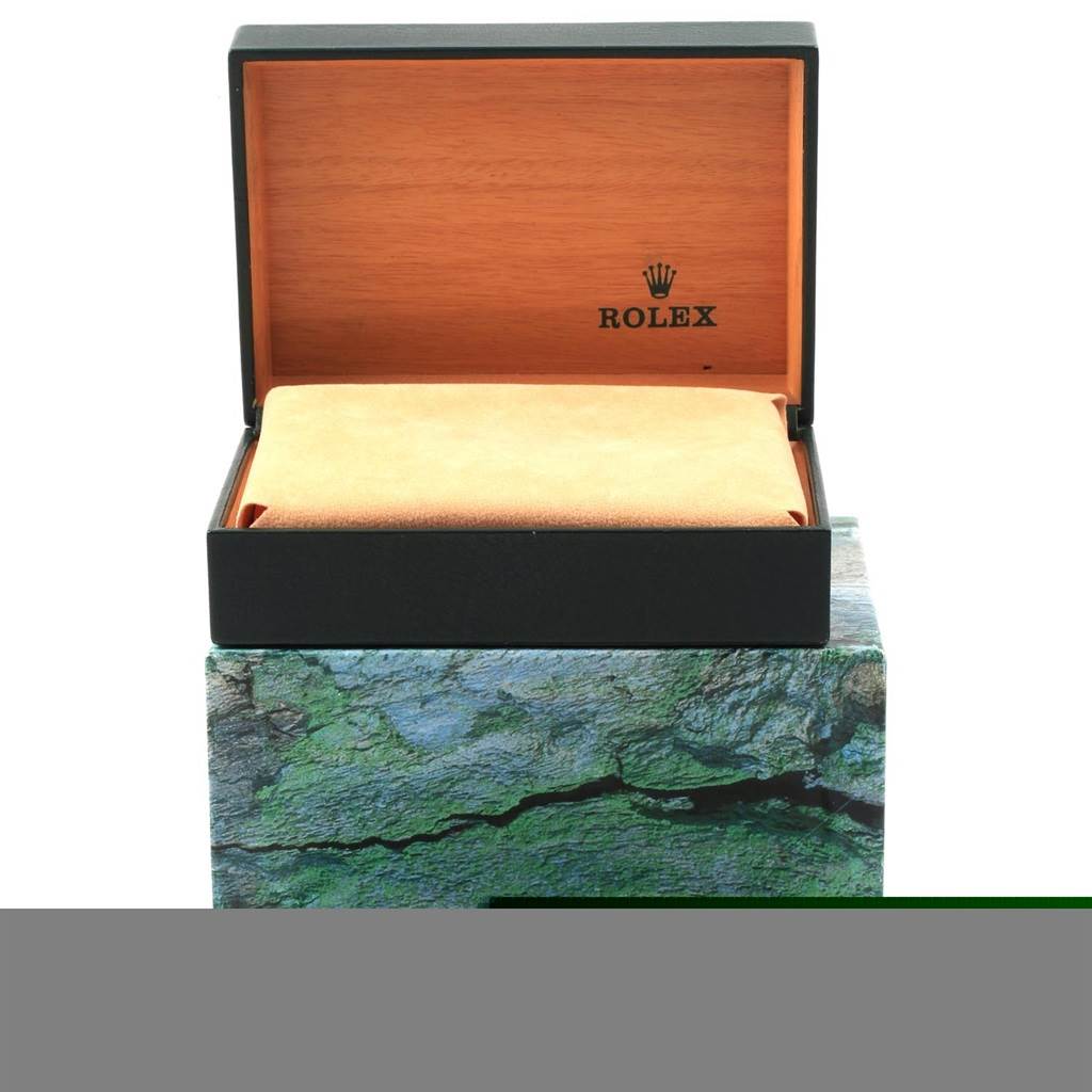 The image shows an open Rolex box without the Datejust model watch, displaying the interior and the Rolex logo.