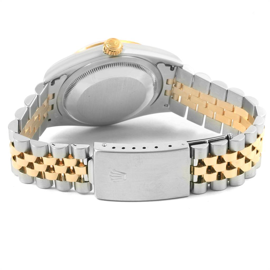 This image shows the back view of a Rolex Datejust 16233 Men
s Steel and Gold (two tone) Champagne Dial 16233 Men
s Steel and Gold (two tone) Champagne Dial watch, highlighting the case back, two-tone metal bracelet, and clasp.