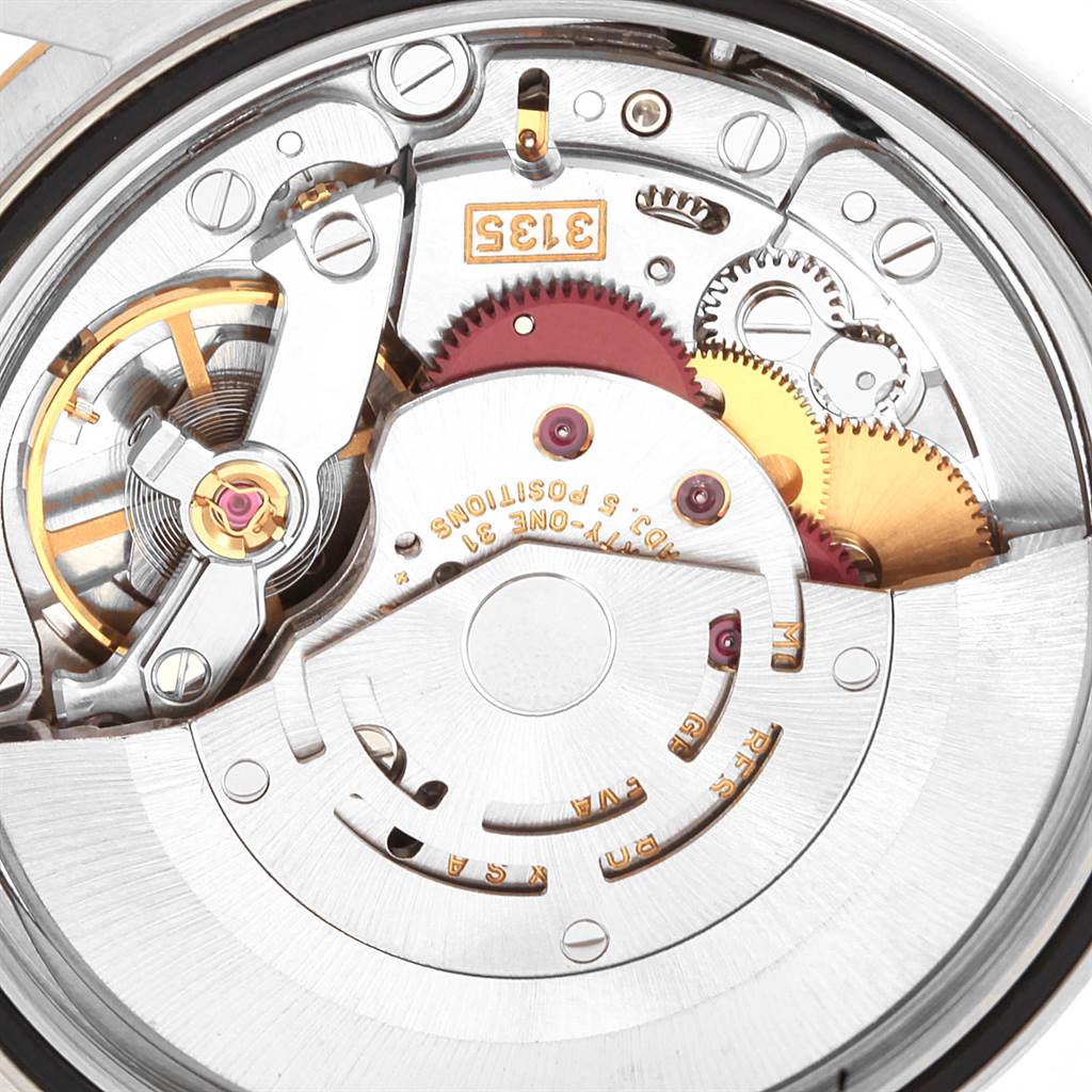 This image shows a close-up view of the internal mechanism of a Rolex Datejust 16233 Men
s Steel and Gold (two tone) Champagne Dial 16233 Men
s Steel and Gold (two tone) Champagne Dial model watch, highlighting its intricate gears and components.