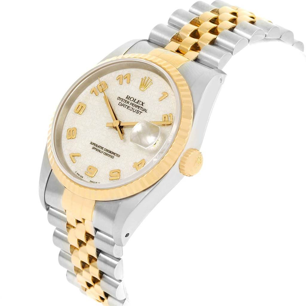 This image shows a Rolex Datejust 16233 Men
s Steel and Gold (two tone) Beige Dial 16233 Men
s Steel and Gold (two tone) Beige Dial watch at an angled view, highlighting its face, bezel, crown, and two-tone metal bracelet.