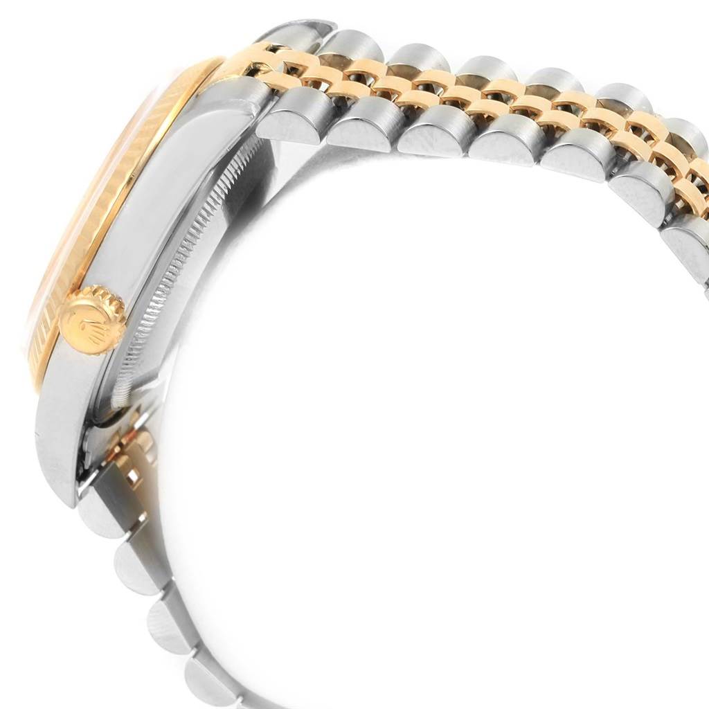 The image shows a side view of a Rolex Datejust 16233 Men
s Steel and Gold (two tone) Beige Dial 16233 Men
s Steel and Gold (two tone) Beige Dial watch, highlighting the crown, case, and bracelet links.