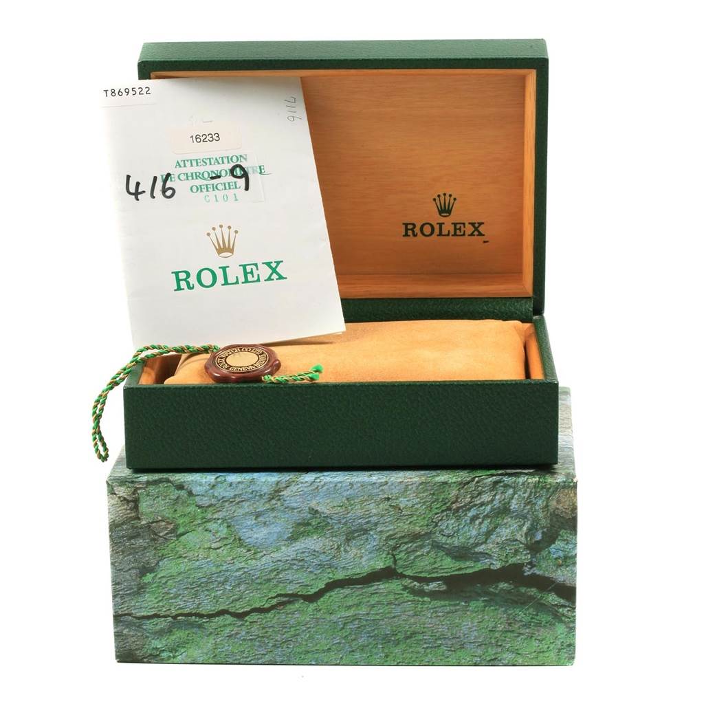 The image shows a Rolex Datejust 16233 Men's Steel and Gold (two tone) Silver Dial 16233 Men's Steel and Gold (two tone) Silver Dial model box, open with papers, a pouch, and a tag inside.