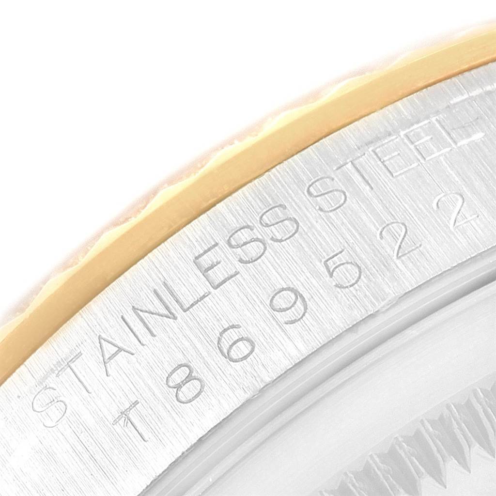 This close-up angle shows the case and part of the bezel with "STAINLESS STEEL" engraving on the Rolex Datejust 16233 Men's Steel and Gold (two tone) Silver Dial 16233 Men's Steel and Gold (two tone) Silver Dial watch.
