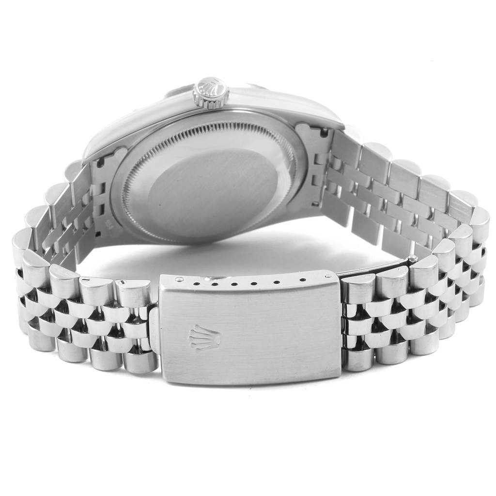 The image shows the back view of a Rolex Datejust 16220 Men
s Stainless Steel Black Dial 16220 Men
s Stainless Steel Black Dial watch, highlighting the case back and Jubilee bracelet clasp.