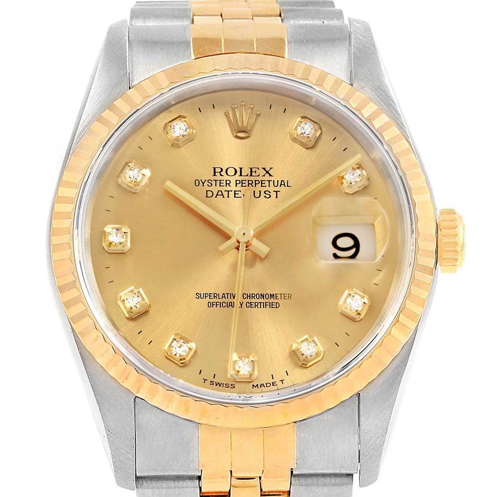 This Rolex Datejust 16233 Men's Steel and Gold (two tone) Champagne Dial 16233 Men's Steel and Gold (two tone) Champagne Dial watch is shown from the front, displaying its dial, bezel, and part of the band.