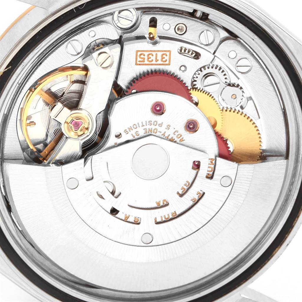 This image shows the intricate movement mechanism from the back angle of a Rolex Datejust 16233 Men's Steel and Gold (two tone) Champagne Dial 16233 Men's Steel and Gold (two tone) Champagne Dial watch.