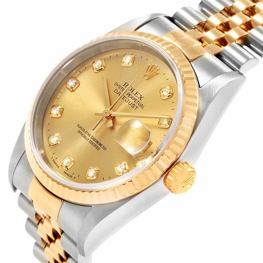 This image shows a Rolex Datejust 16233 Men's Steel and Gold (two tone) Champagne Dial 16233 Men's Steel and Gold (two tone) Champagne Dial watch at an angle displaying its gold dial, fluted bezel, crown, and two-tone Jubilee bracelet.