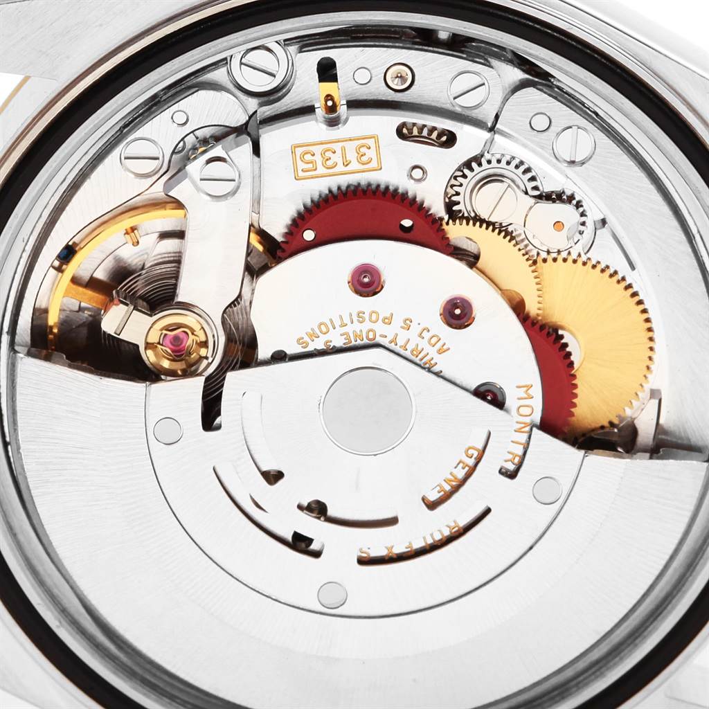 This image shows the internal mechanical movement of a Rolex Datejust 16233 Men's Steel and Gold (two tone) Silver Dial 16233 Men's Steel and Gold (two tone) Silver Dial watch model from an angled close-up view.