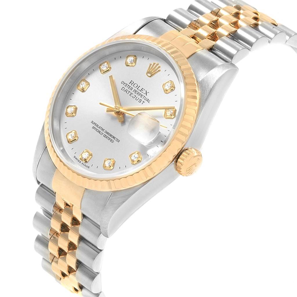 This image shows a Rolex Datejust 16233 Men's Steel and Gold (two tone) Silver Dial 16233 Men's Steel and Gold (two tone) Silver Dial watch at a three-quarter angle, highlighting its face, crown, and two-tone bracelet.