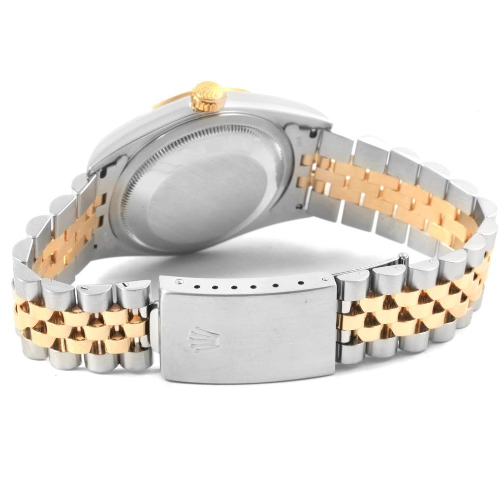 This image shows the back case and clasp of a Rolex Datejust 16233 Men's Steel and Gold (two tone) Silver Dial 16233 Men's Steel and Gold (two tone) Silver Dial watch, featuring a two-tone metal bracelet.