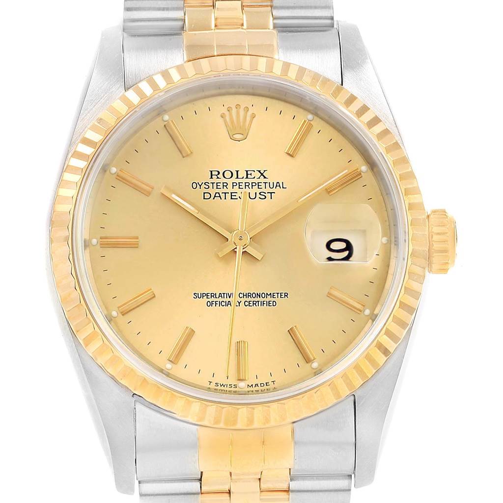 This image shows a front view of a Rolex Datejust 16233 Men
s Steel and Gold (two tone) Champagne Dial 16233 Men
s Steel and Gold (two tone) Champagne Dial watch, highlighting its gold dial, fluted bezel, and two-tone bracelet.
