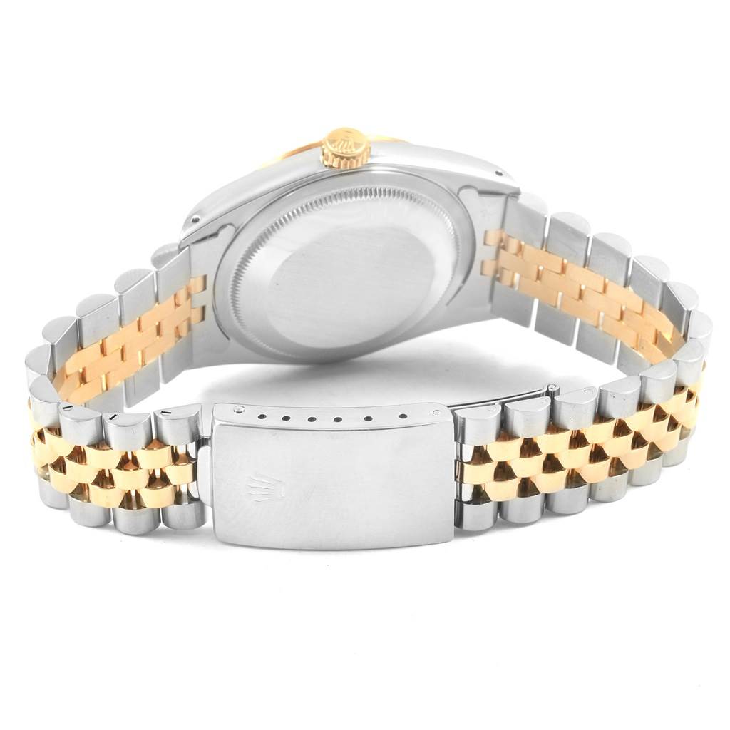 This image shows the back case and Jubilee bracelet of a Rolex Datejust 16233 Men
s Steel and Gold (two tone) Champagne Dial 16233 Men
s Steel and Gold (two tone) Champagne Dial watch.