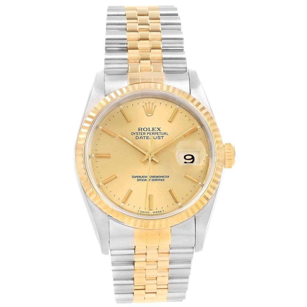 This Rolex Datejust 16233 Men
s Steel and Gold (two tone) Champagne Dial 16233 Men
s Steel and Gold (two tone) Champagne Dial watch is shown from a front angle, displaying its gold dial, fluted bezel, two-tone bracelet, and date window.