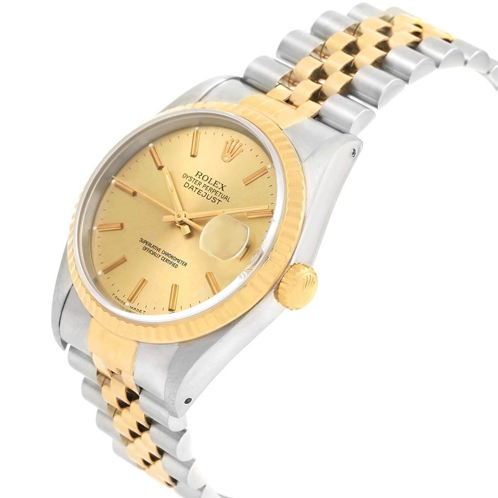 This image shows a side angle of a Rolex Datejust 16233 Men
s Steel and Gold (two tone) Champagne Dial 16233 Men
s Steel and Gold (two tone) Champagne Dial watch, highlighting its gold dial, bezel, crown, and two-tone bracelet.