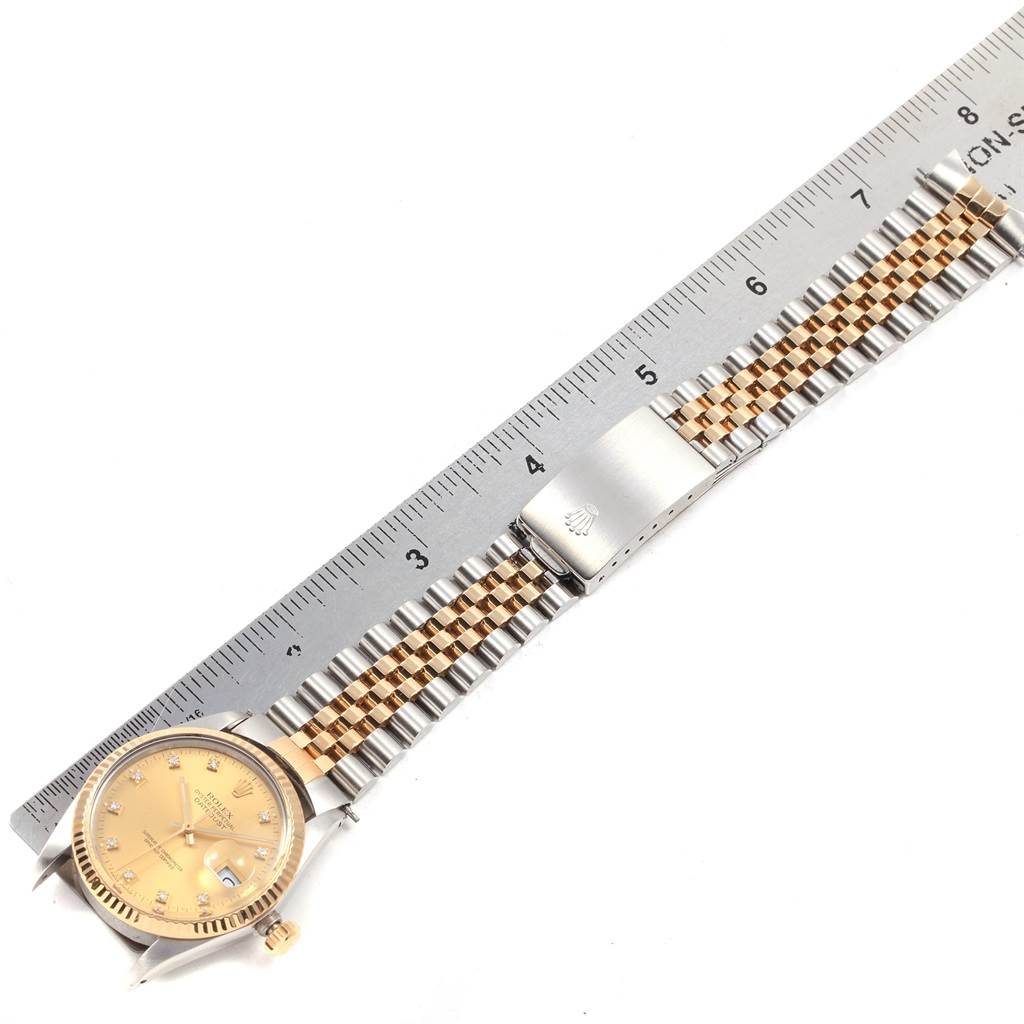 The image shows a Rolex Datejust 16013 Men's Stainless Steel Champagne Dial 16013 Men's Stainless Steel Champagne Dial watch laid flat next to a ruler, highlighting the face, bezel, bracelet, and clasp.