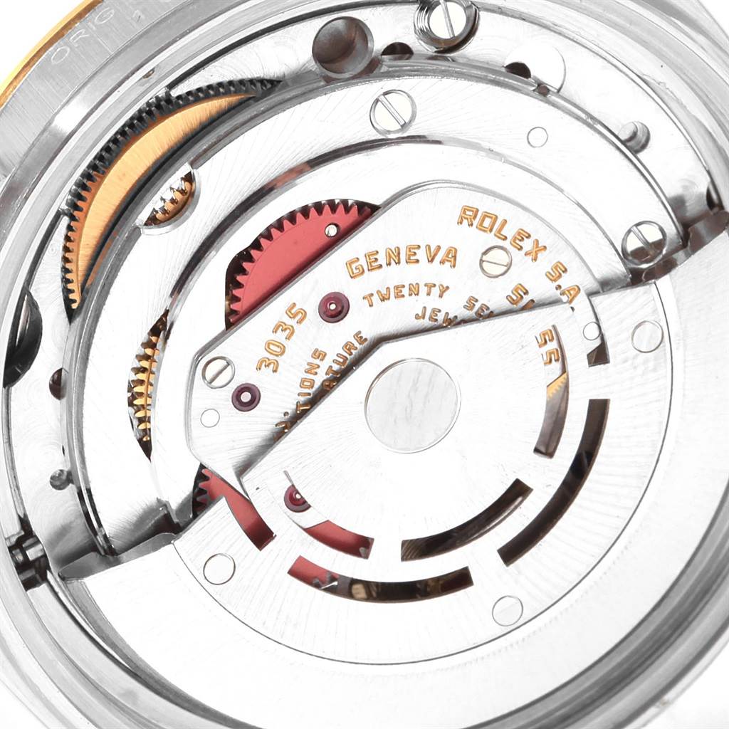This image shows the internal mechanism of a Rolex Datejust 16013 Men's Stainless Steel Champagne Dial 16013 Men's Stainless Steel Champagne Dial watch, highlighting the movement components, gears, and markings.
