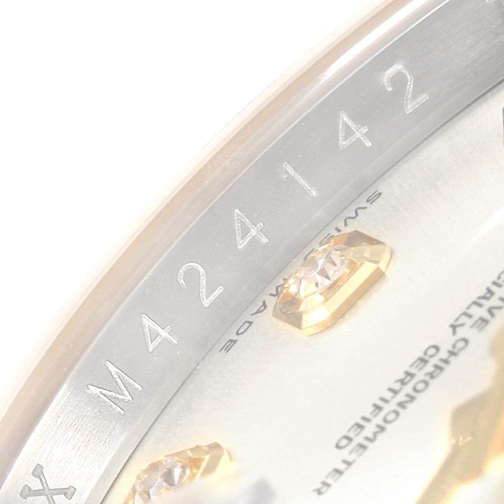 This image shows a close-up view of the dial and the inner bezel of a Rolex Datejust 116233 Men's Stainless Steel Silver Dial 116233 Men's Stainless Steel Silver Dial watch, highlighting the serial number and jewel markers.