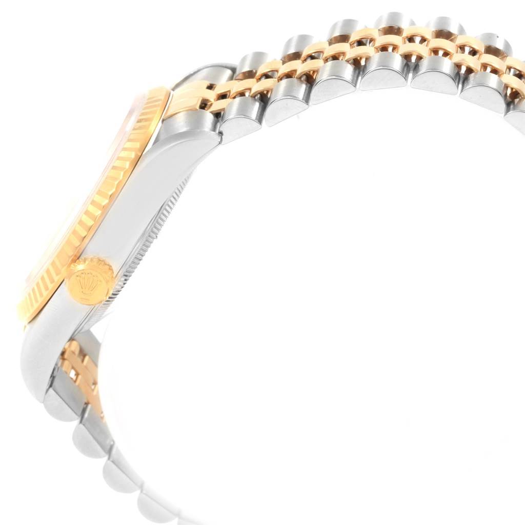 The image shows a side view of a Rolex Datejust 16233 Men's Steel and Gold (two tone) Champagne Dial 16233 Men's Steel and Gold (two tone) Champagne Dial watch, highlighting the crown and two-tone bracelet.