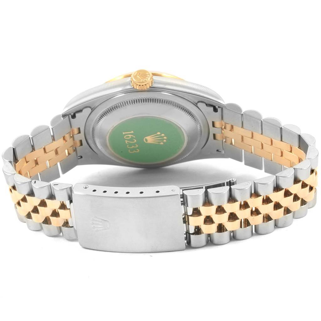 The image shows a Rolex Datejust 16233 Men's Steel and Gold (two tone) Champagne Dial 16233 Men's Steel and Gold (two tone) Champagne Dial watch from the back, highlighting its case back, bracelet, and clasp.