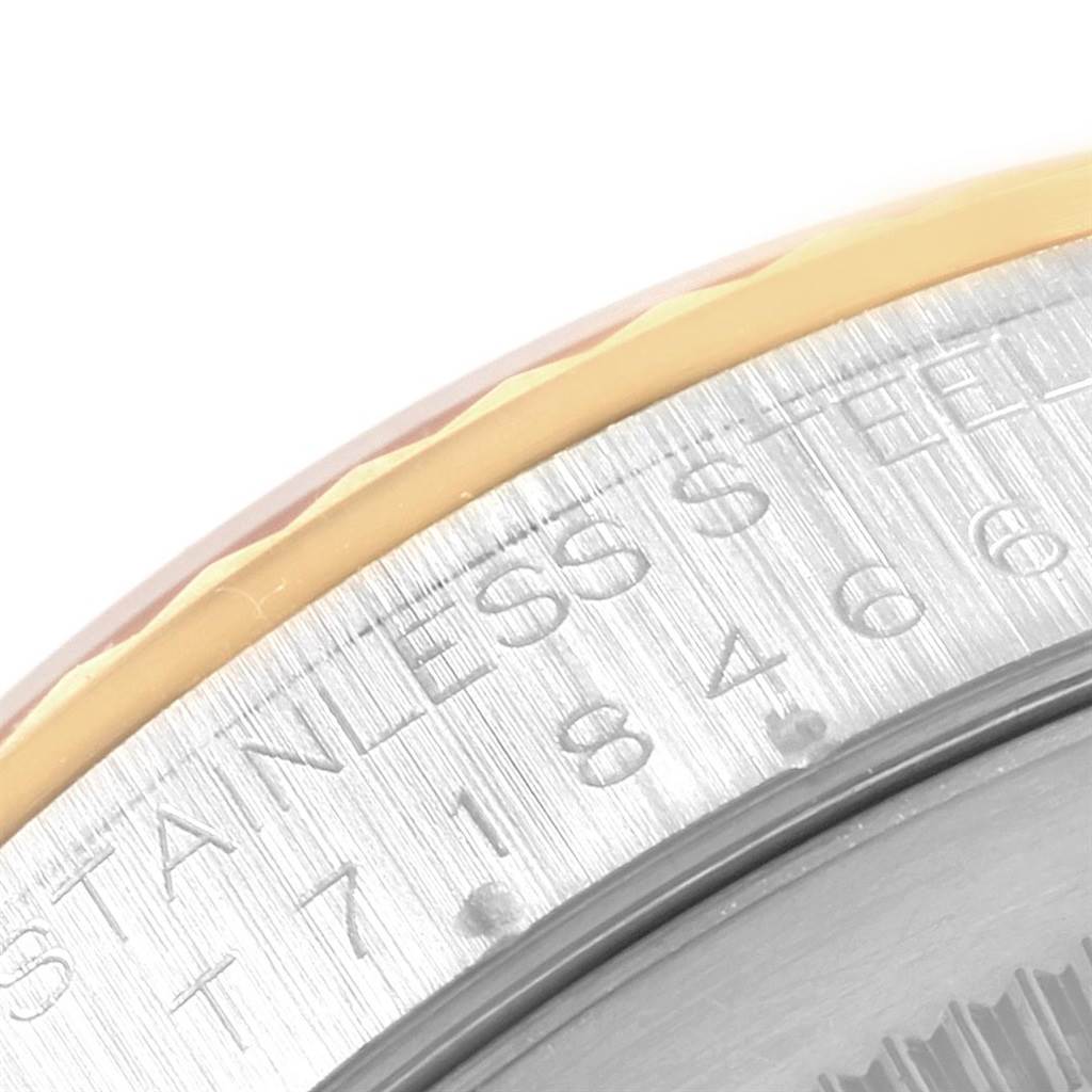 The image shows a close-up angle of the edge of the bezel and case back of a Rolex Datejust 16233 Men's Steel and Gold (two tone) Champagne Dial 16233 Men's Steel and Gold (two tone) Champagne Dial watch.
