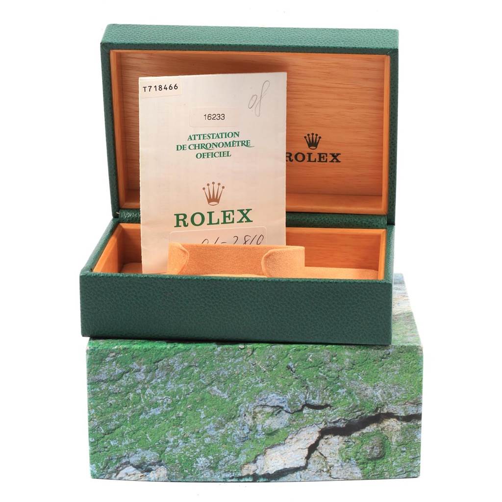 The image shows a green Rolex Datejust 16233 Men's Steel and Gold (two tone) Champagne Dial 16233 Men's Steel and Gold (two tone) Champagne Dial watch box with documentation inside, viewed from the front at eye level.