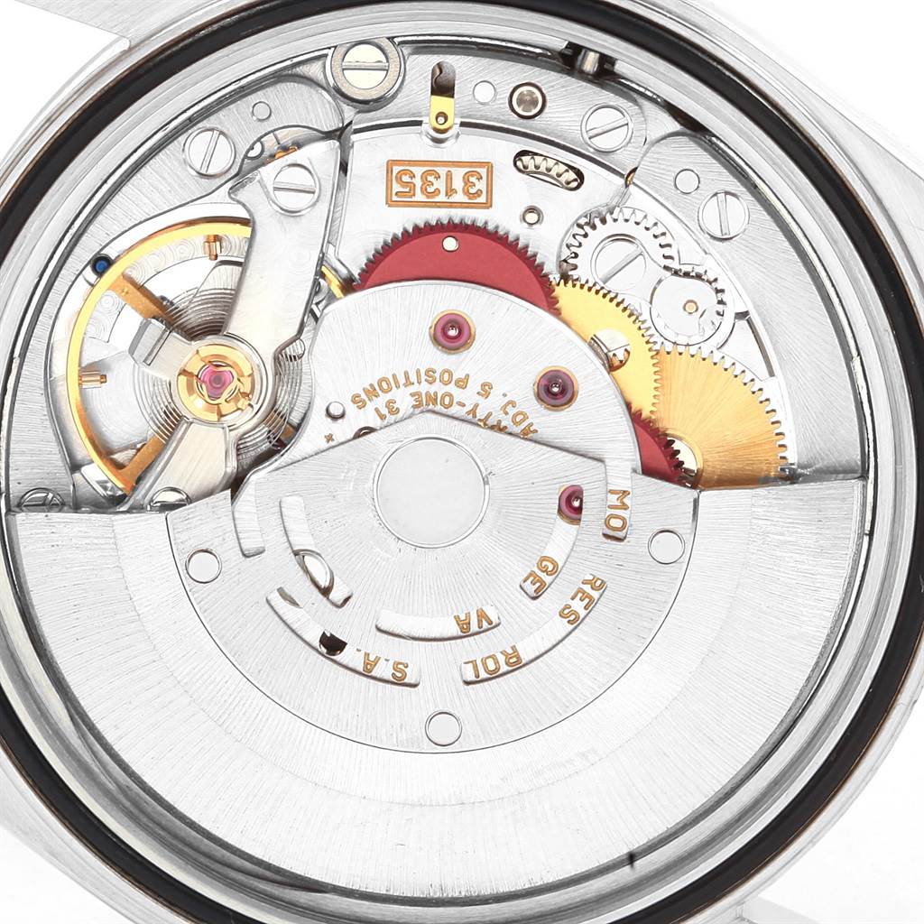 The image shows a close-up view of the mechanical movement inside a Rolex Datejust 16233 Men's Steel and Gold (two tone) Champagne Dial 16233 Men's Steel and Gold (two tone) Champagne Dial watch.
