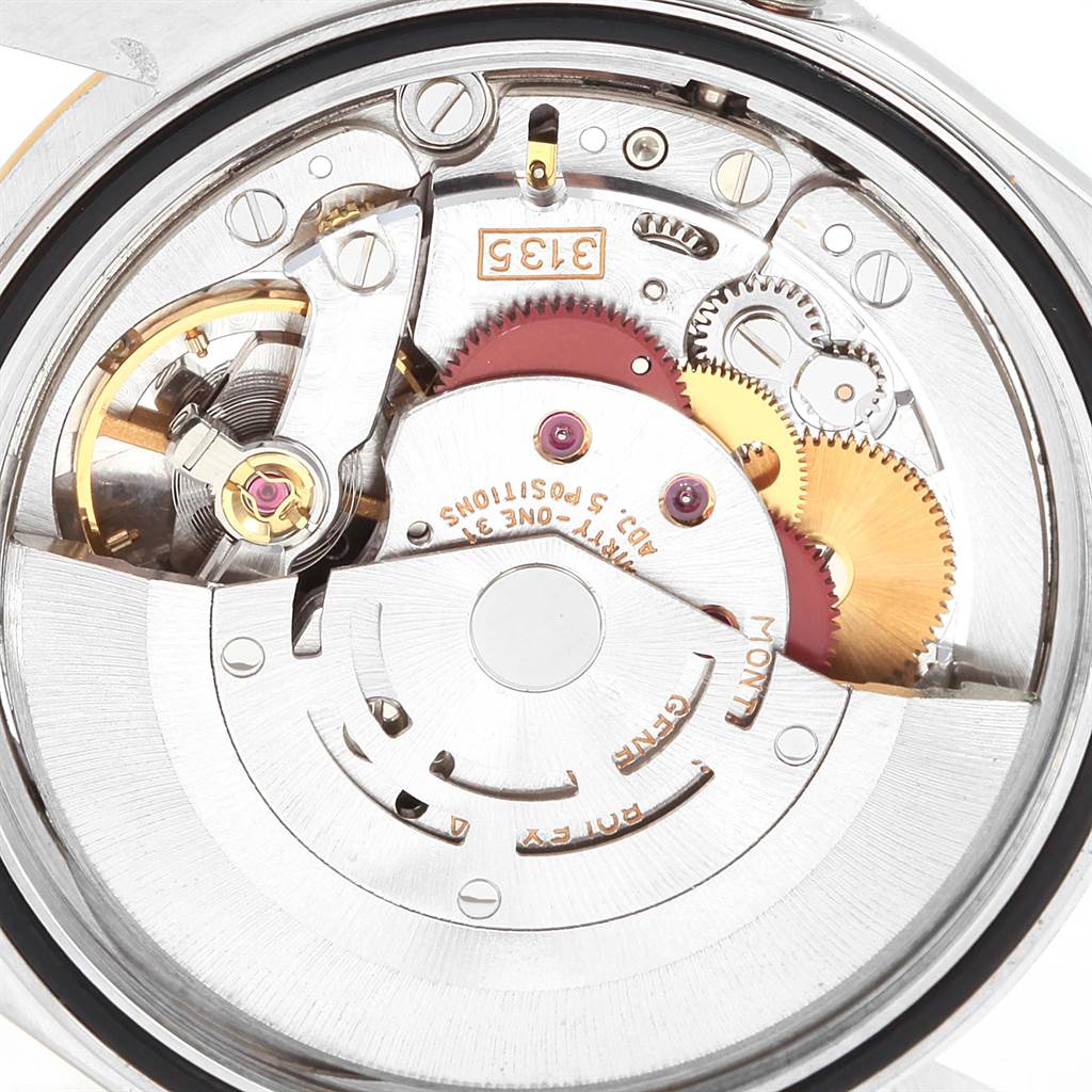 This image shows a close-up view of the intricate mechanical movement inside a Rolex Datejust 16233 Men
s Steel and Gold (two tone) Beige Dial 16233 Men
s Steel and Gold (two tone) Beige Dial watch.