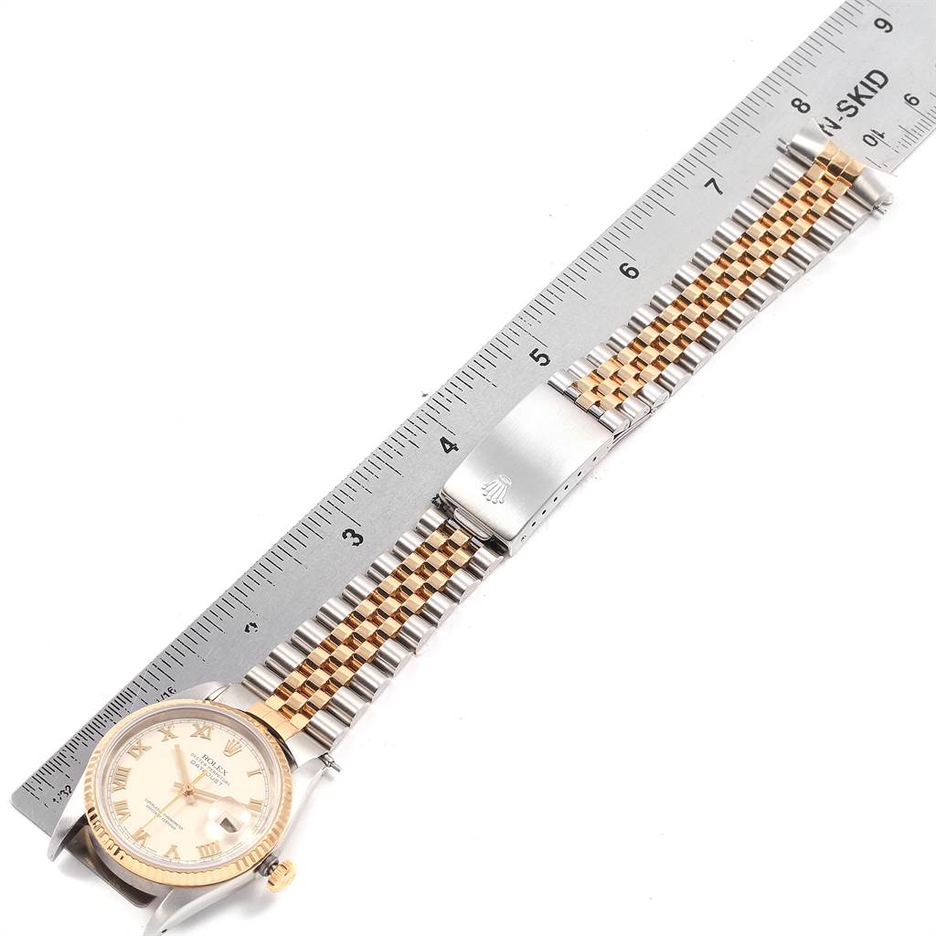 The image shows a Rolex Datejust 16233 Men
s Steel and Gold (two tone) Beige Dial 16233 Men
s Steel and Gold (two tone) Beige Dial watch laid flat with the face and Jubilee bracelet visible, next to a ruler for size reference.