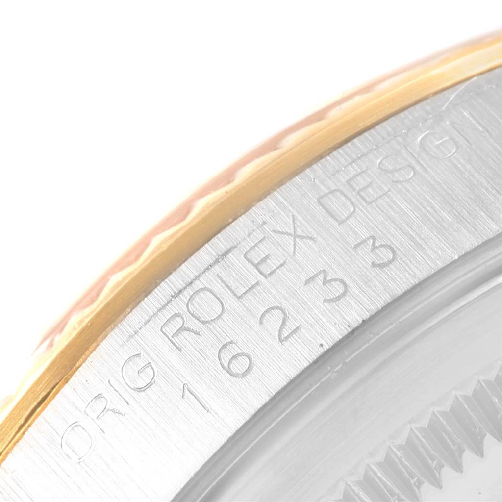 The image shows a close-up of the bezel and case side of a Rolex Datejust 16233 Men
s Steel and Gold (two tone) Beige Dial 16233 Men
s Steel and Gold (two tone) Beige Dial watch, highlighting the engraved model number.