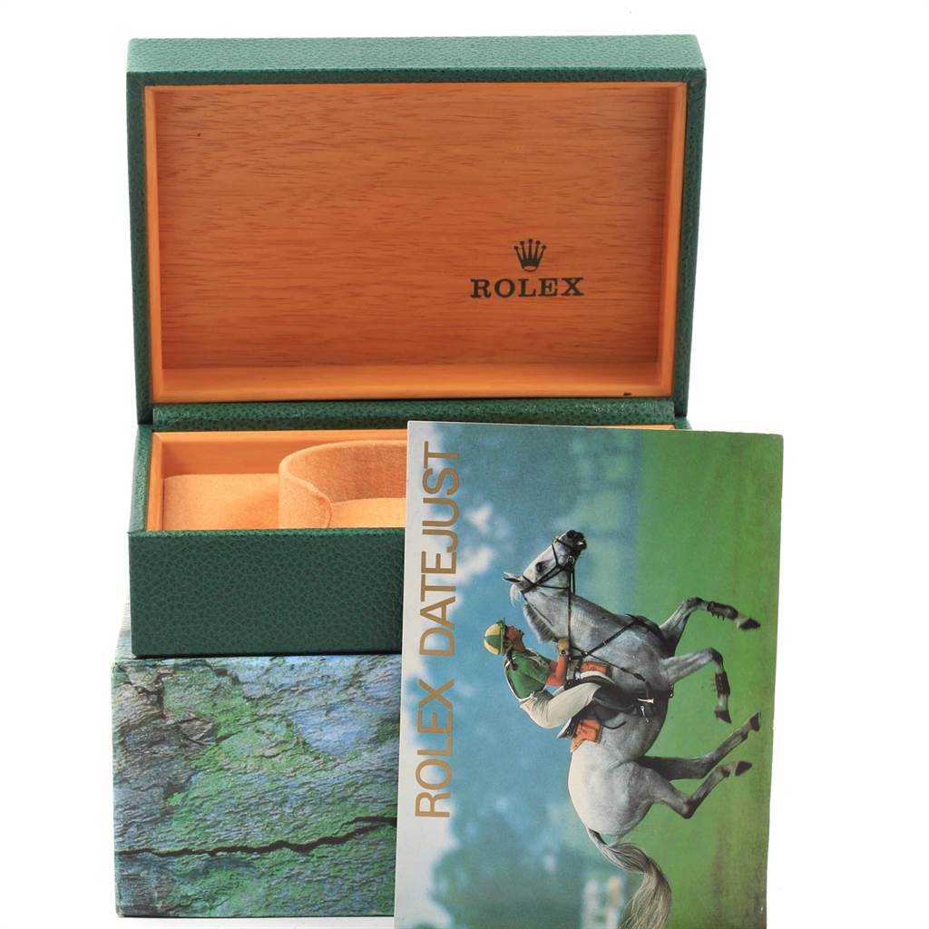 This image shows an open Rolex Datejust 16233 Men
s Steel and Gold (two tone) Beige Dial 16233 Men
s Steel and Gold (two tone) Beige Dial box with a booklet in front of it.