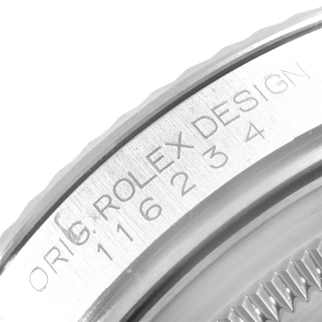 This image shows a close-up of the engraving on the bezel of a Rolex Datejust 116234 Men's Stainless Steel Black Dial 116234 Men's Stainless Steel Black Dial watch.